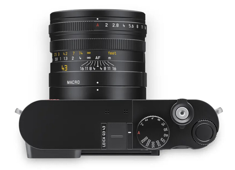 Leica M rangefinder camera with 28mm macro lens mounted, top-down view