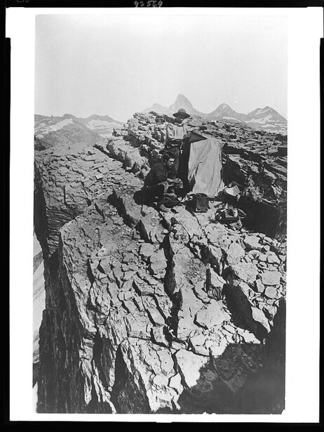 Rocky mountain ridge with dramatic columnar basalt formations and peaks in soft black and white light