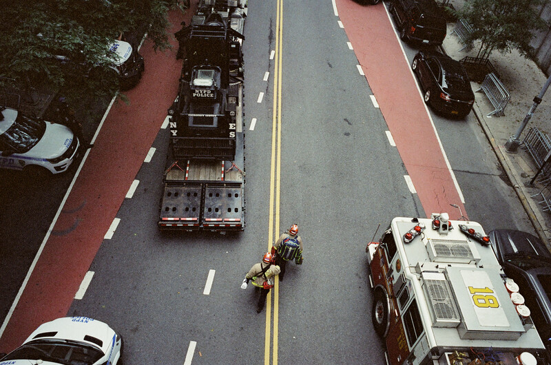 Aerial view of street intersection with emergency vehicles and personnel responding to incident