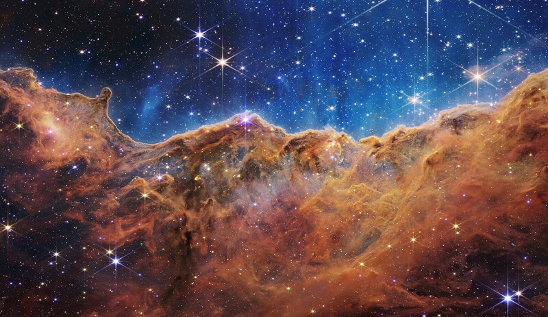 The  Cosmic Cliffs  region within Carina (NGC 3324), captured by the NIRCam instrument aboard the James Webb Space Telescope