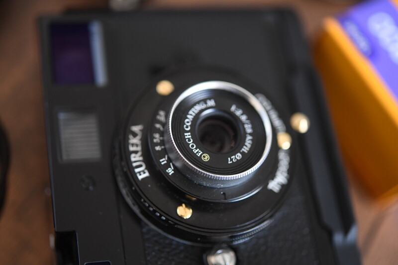Closeup of a Fujifilm rangefinder camera lens and body with vintage aesthetic