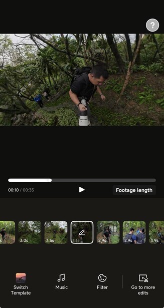 Videographer operating camera equipment in wooded outdoor setting