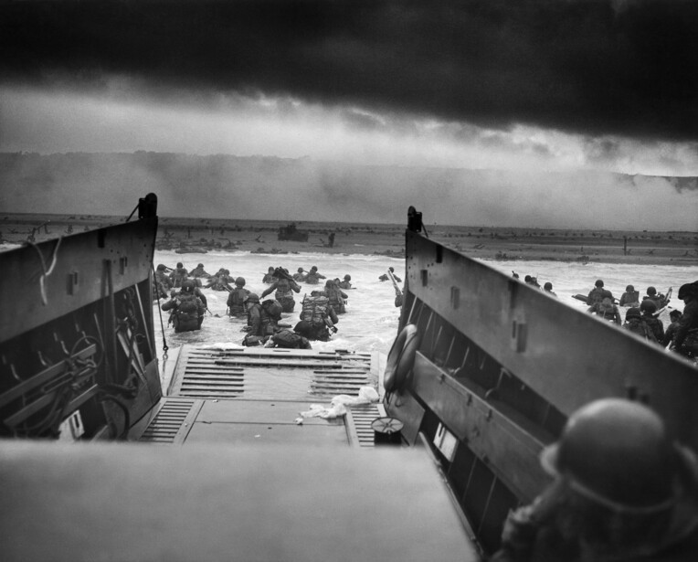 Into the Jaws of Death : troops of Company E, 16th Infantry, 1st Infantry Division wade ashore from a Coast Guard-manned landing craft onto the Easy Red sector of Omaha Beach on the morning of June 6, 1944