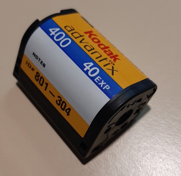 A Kodak Advantix cartridge for the IX240 Advanced Photo System, the mid-1990s Kodak-led format that inherited the disc's ambition of a compact, data-encoded, fully automated film system