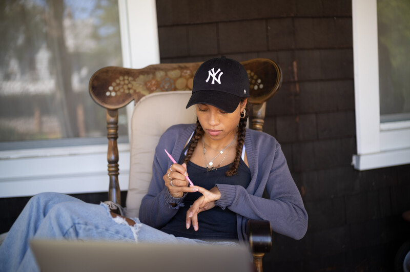 Girl painting her fingernails