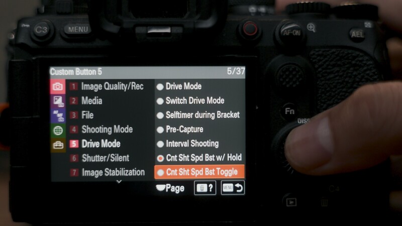 Screenshot of camera menu settings showing Custom Button options and shooting mode configurations