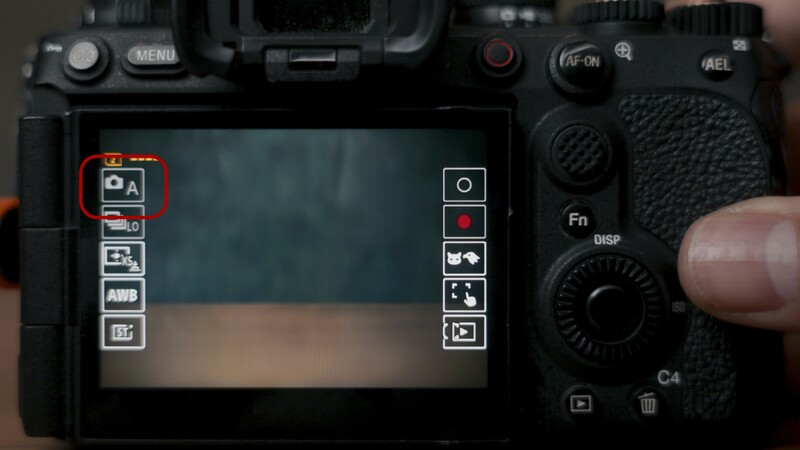 Sony mirrorless camera rear LCD screen showing exposure compensation menu highlighted in red