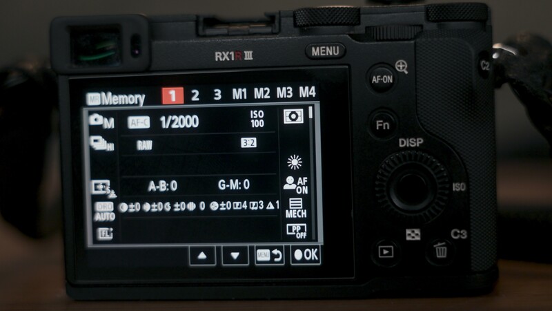 Sony RX1 II camera rear LCD screen displaying shooting settings and menu