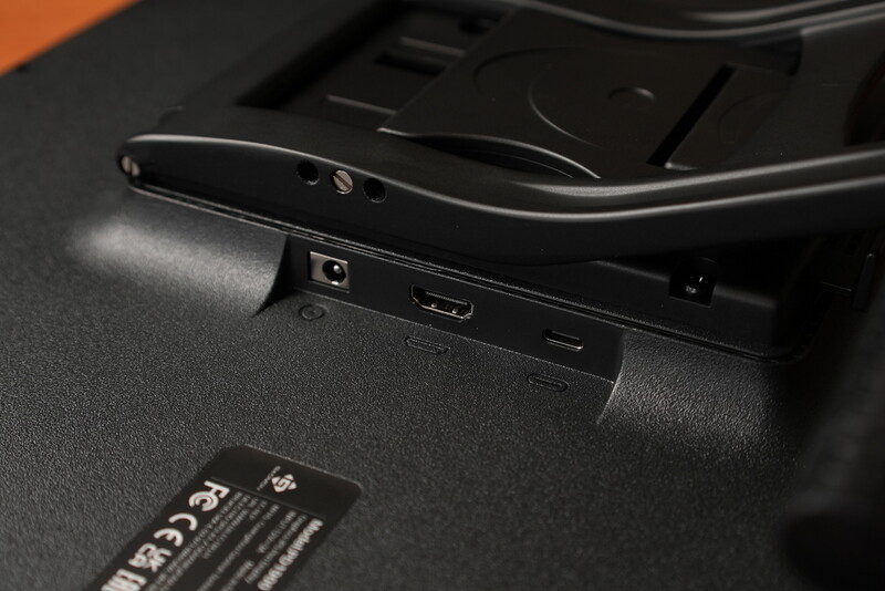 Close-up of camera body ports including HDMI and USB connectivity on black device