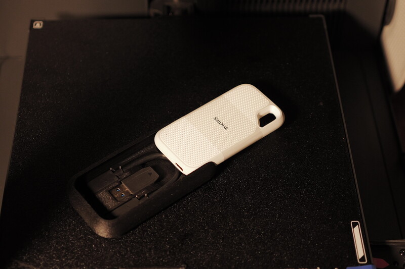 Nokia N97 smartphone with white protective case displayed on black textured surface