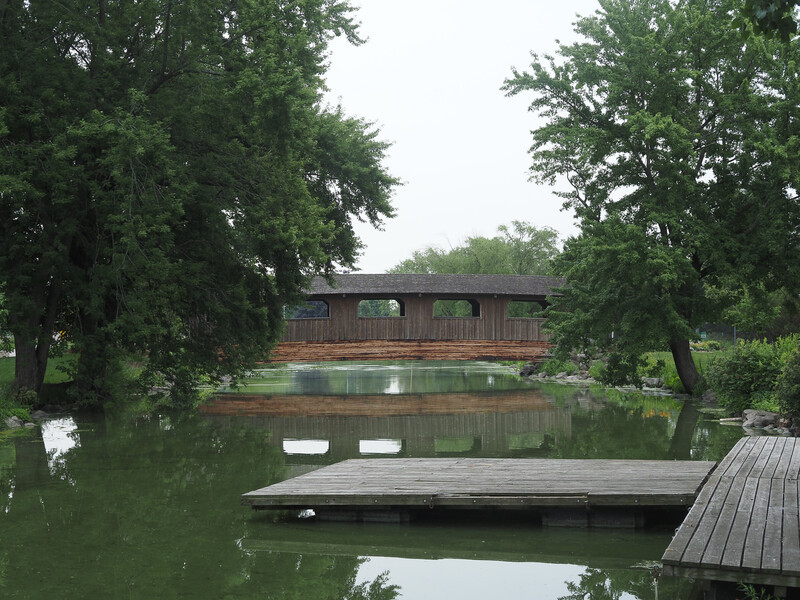 Photo of a covered bridge over water