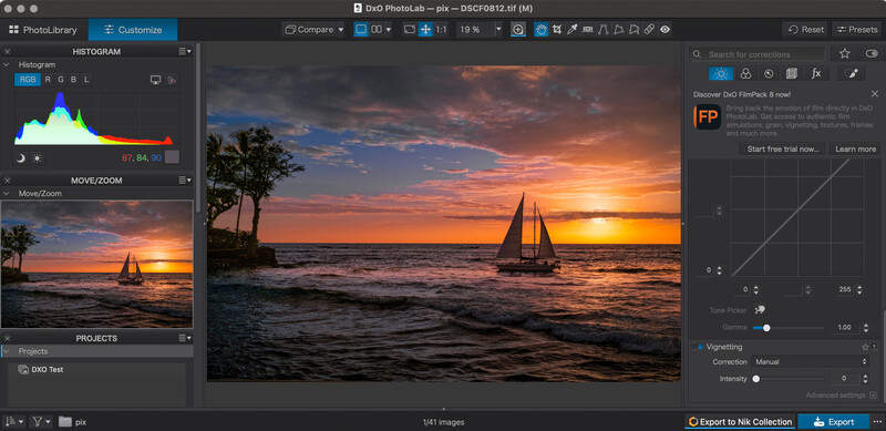 Screenshot of DXO PhotoLab editing software displaying a golden-hour seascape with sailboat