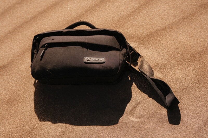 The SX5 Padded Sling sitting on the sand. 