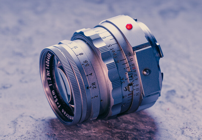 Vintage rangefinder camera lens with helicoid focusing mechanism and red shutter release button