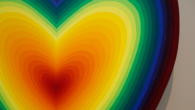 Illustration of concentric heart shapes in vibrant rainbow gradient colors