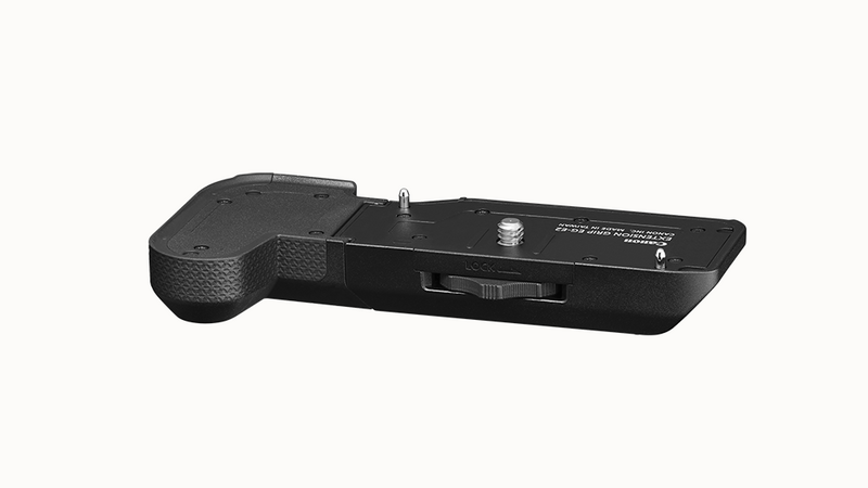 Black battery grip attachment with textured grip area and cable release socket