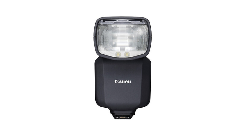 Canon speedlite flash unit with black body and white diffuser dome