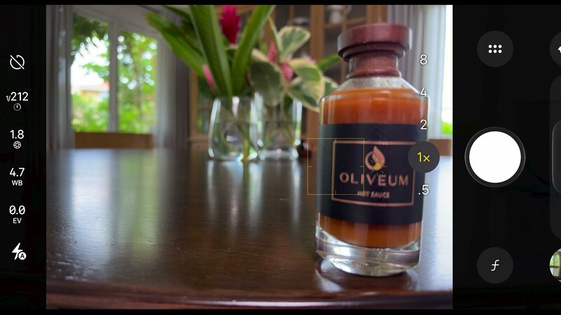 The iPhone 18 Pro native camera app showing the manual lens aperture control set to f/1.8