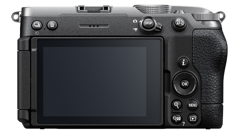 Rear view of a mirrorless camera body showing LCD screen and control buttons