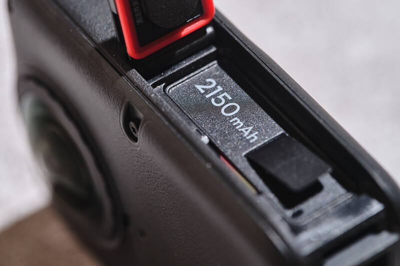 Close-up of camera battery compartment showing 2450mAh capacity marking