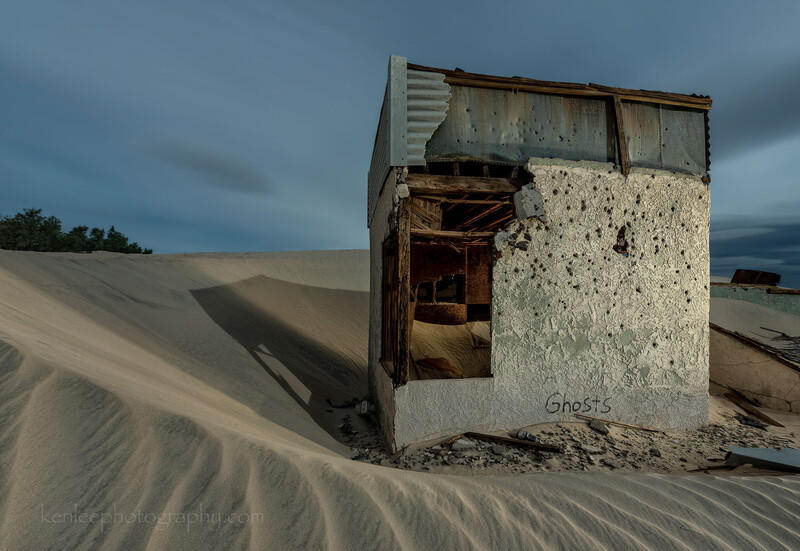 House buried in sand, Mojave Desert