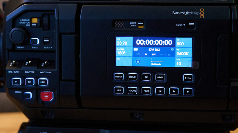 Blackmagic Design video camera control panel with touchscreen display showing timecode and recording settings