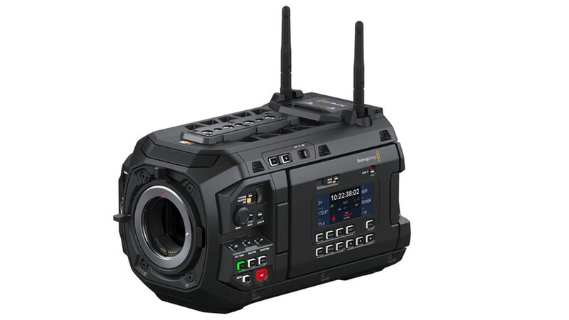 Professional cinema camera with dual wireless antenna modules and integrated monitor display