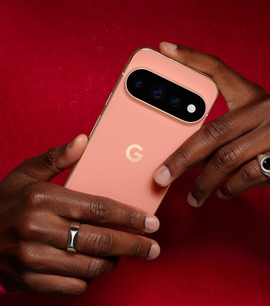 Google Pixel 11 Pro in Canyon held in two hands, showing its camera bar