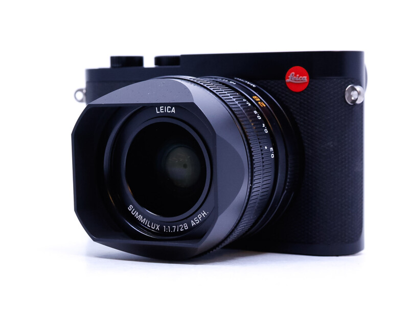 Leica Q rangefinder camera with Summilux lens on white background