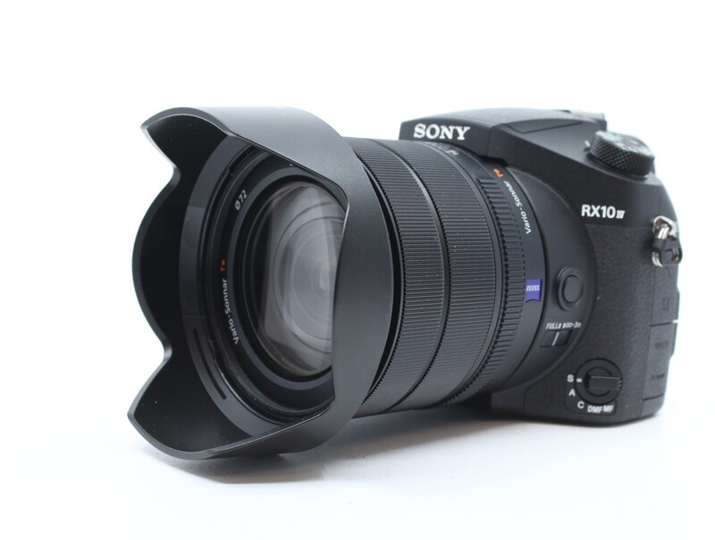 Sony RX10 Mark IV compact camera with wide-angle lens and lens hood attached