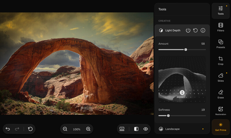 Screenshot of photo editing software showing a landscape image of a red natural stone arch with editing panels visible