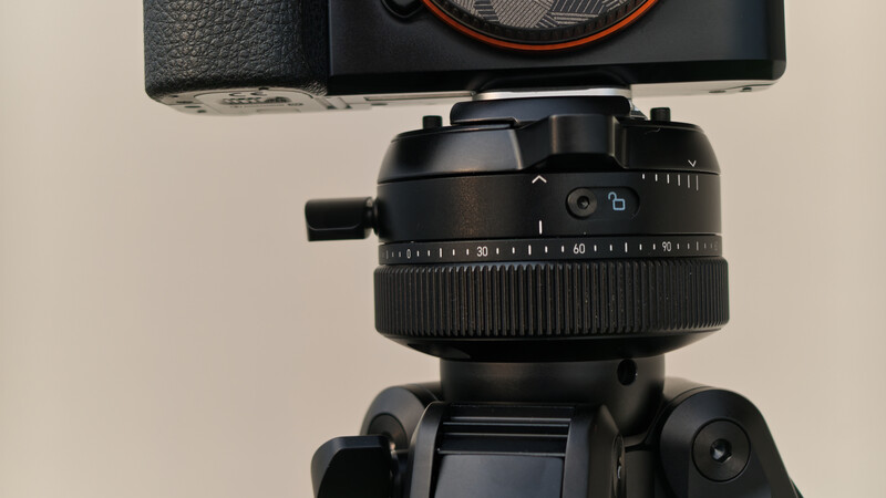 Ball head tripod mount with panoramic rotation scale and leveling indicator mounted on tripod