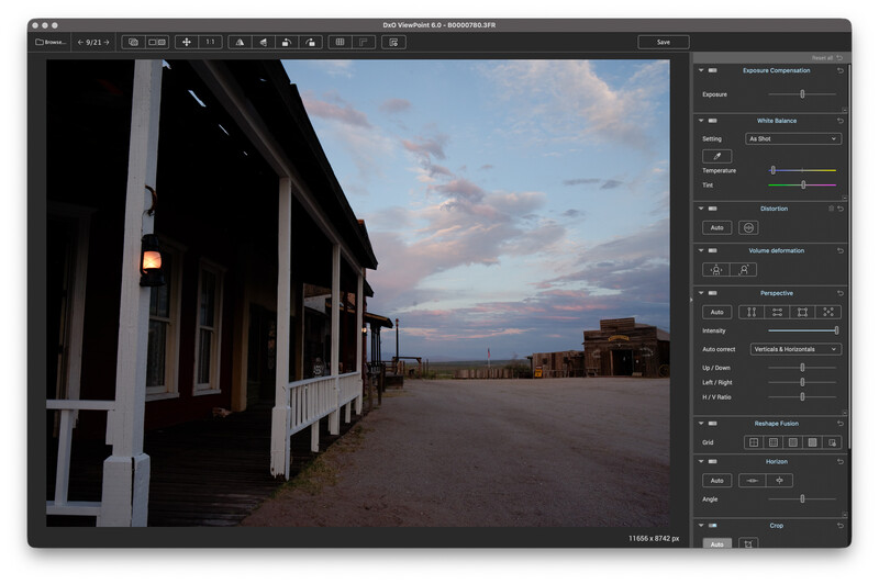 Screenshot of DxO ViewPoint editing a dusk photo of a wooden Western-style building with a white-columned porch and dirt street.