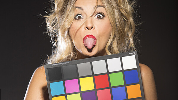 Model making funny face with color chart