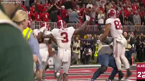 Photographer Knocked to the Ground After Running Onto Field Following Game-Winning Touchdown