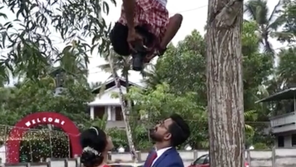 This Wedding Photographer Will Do Anything to Get the Shot