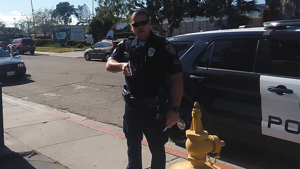 Police Officer on Leave After Pointing Gun at Videographer: Two Sides of the Story