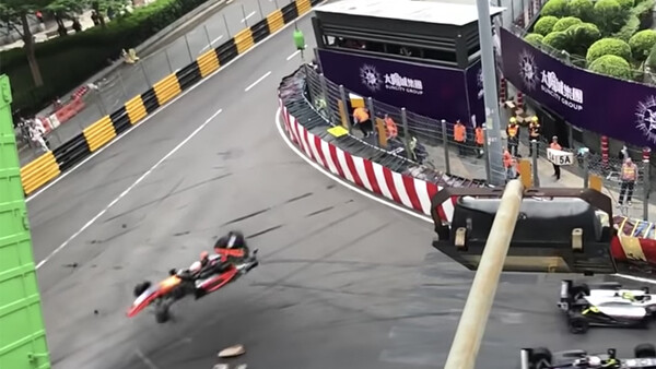 Terrifying Crash Sends Racecar Flying Into Photographers' Booth