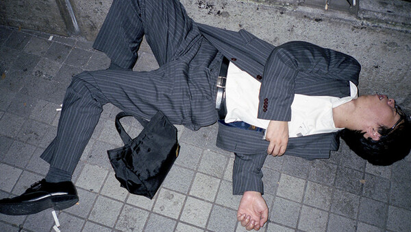 Photo Series of Businessmen Sleeping in the Street Spotlights Tokyo’s Disturbing Overworking Culture