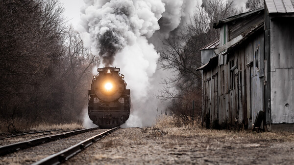 Video Shows Photographer Nearly Killed by Train as It Hits Her and Tears Her Coat