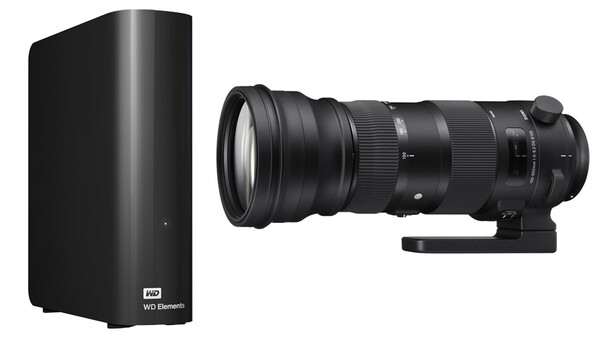 WD Elements external hard drive next to a Sigma telephoto lens on white background.