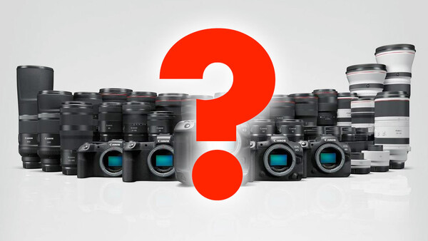 Collection of digital cameras and lenses arranged around a large red question mark.