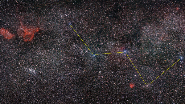 Star field with constellation overlay and colored geometric lines marking star positions.