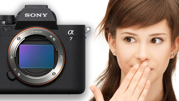 Sony a7 mirrorless camera body displayed next to a surprised woman's face.