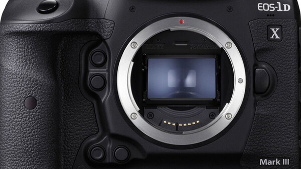 Canon EOS-1D X Mark III DSLR camera body showing open mirror chamber and sensor.