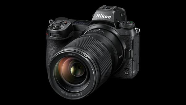 Nikon Z mirrorless camera with attached zoom lens, displayed against black background.