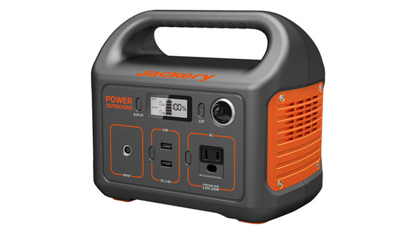 Portable power station with gray and orange casing, featuring digital display, multiple outlet types, and carry handle.