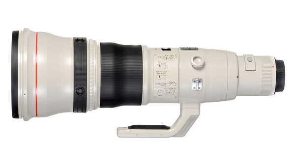 White telephoto lens with red stripe, focus ring, and tripod collar shown in profile against white background.