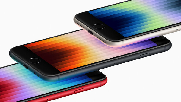 Three smartphones arranged in a cascading composition, each displaying a colorful gradient spectrum across its screen.