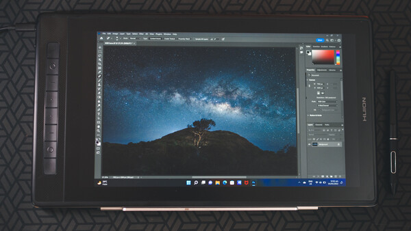 Screenshot of Photoshop displaying a nighttime landscape with silhouetted tree and Milky Way galaxy.